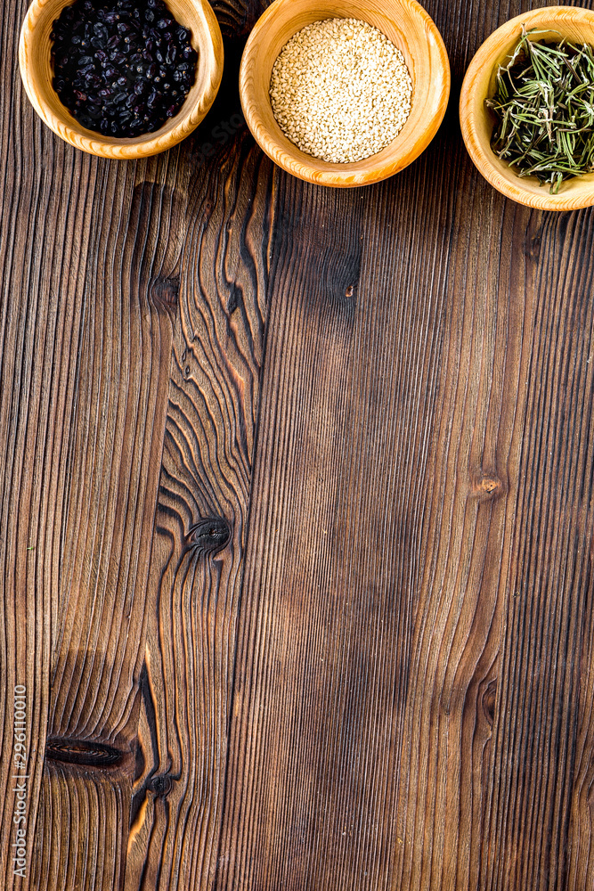 Spices and herbs on wooden kitchen table background top view mock up