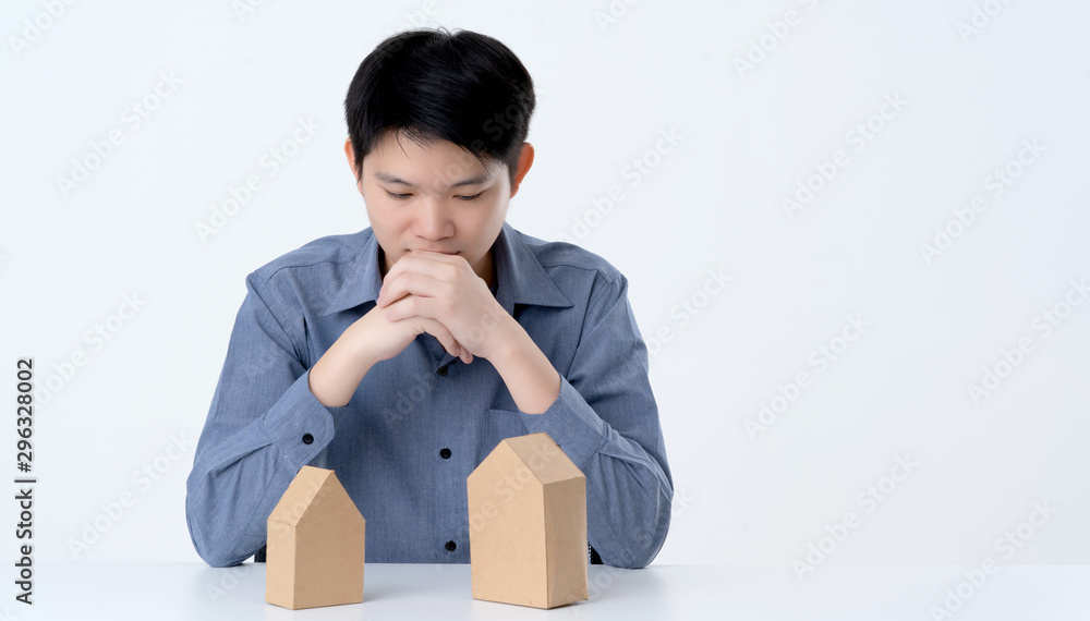 business smart asian man with house model on table house business dicision white background