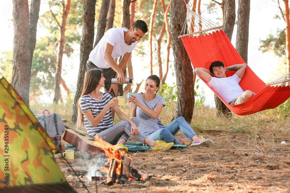 Young friends spending weekend in forest