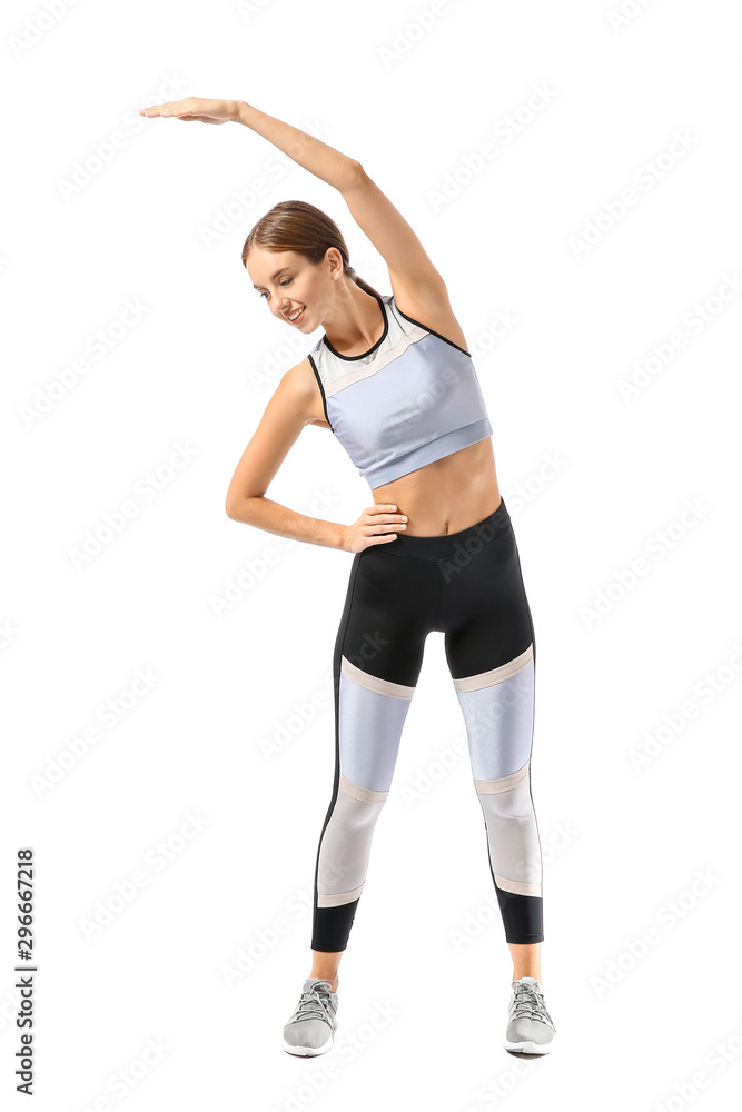 Sporty young woman training against white background