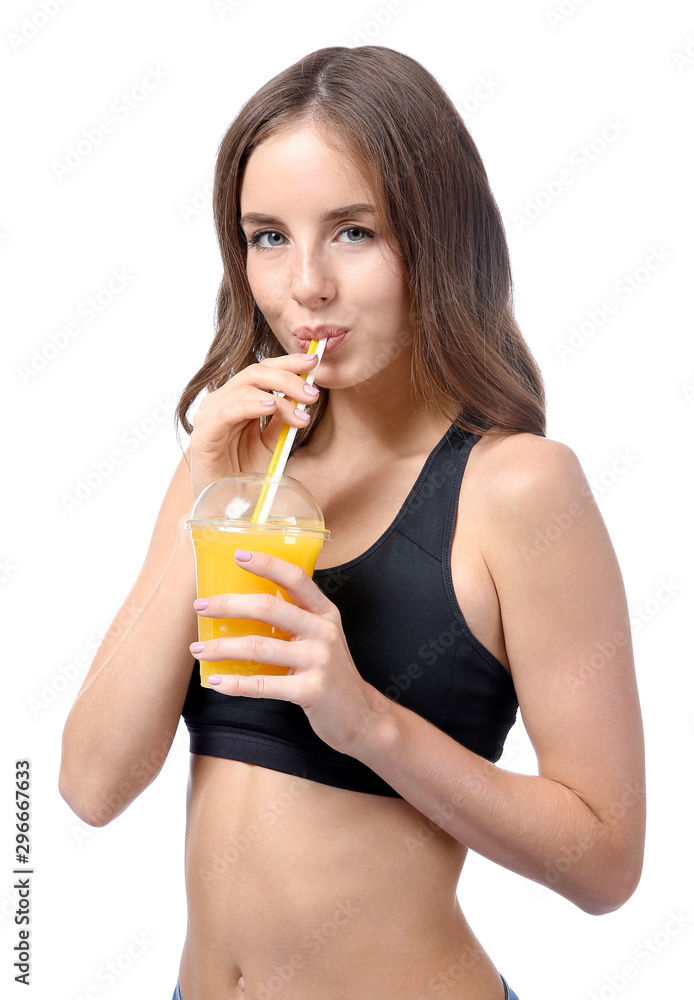 Beautiful young woman with orange juice on white background