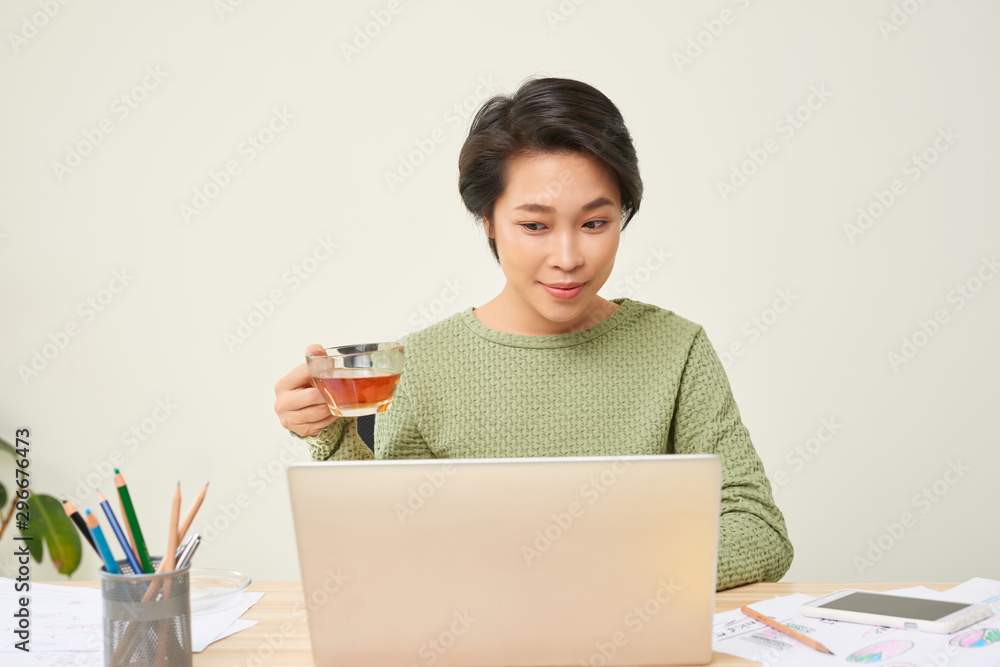 Young businesswoman on a tea break.