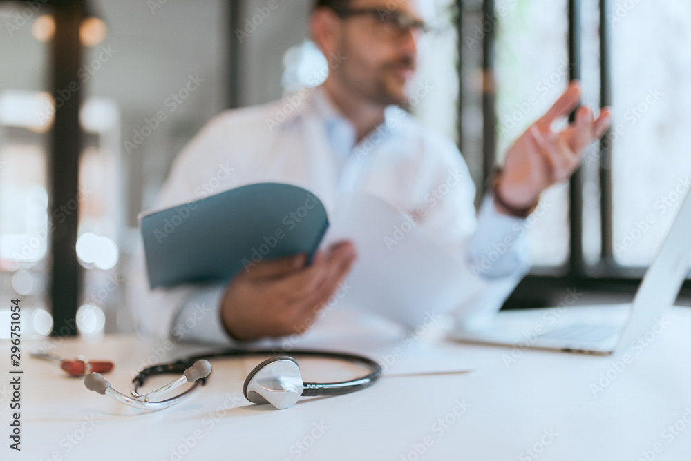 Medicine, healthcare and people concept. Close-up image of a doctor consulting in the office, focus 