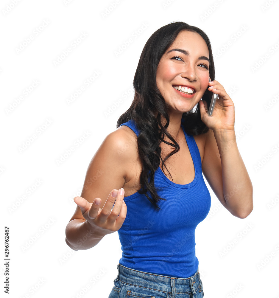 Beautiful Asian woman talking by phone on white background