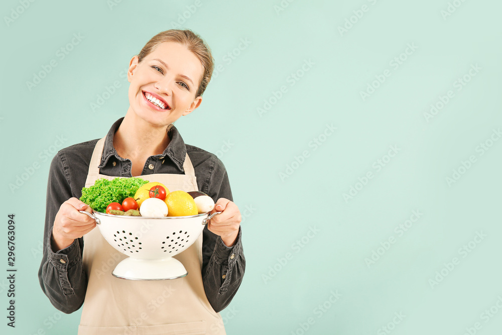 Beautiful young woman with products on color background