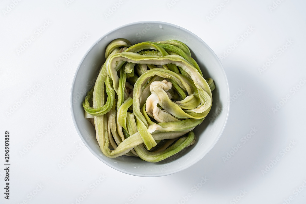 A bowl of soaked tribute on a white background