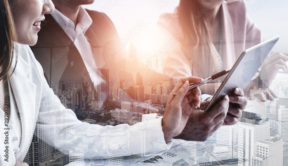 Double exposure image of business people group meeting on city office building in background showing