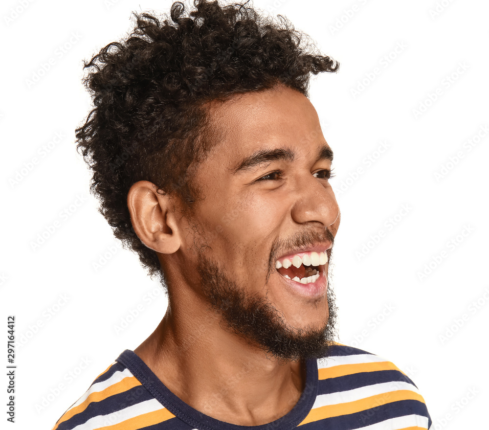 Portrait of happy African-American man on white background