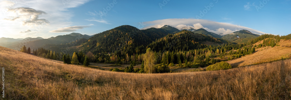 Amazing mountain landscape with colorful vivid sunset on the blue sky