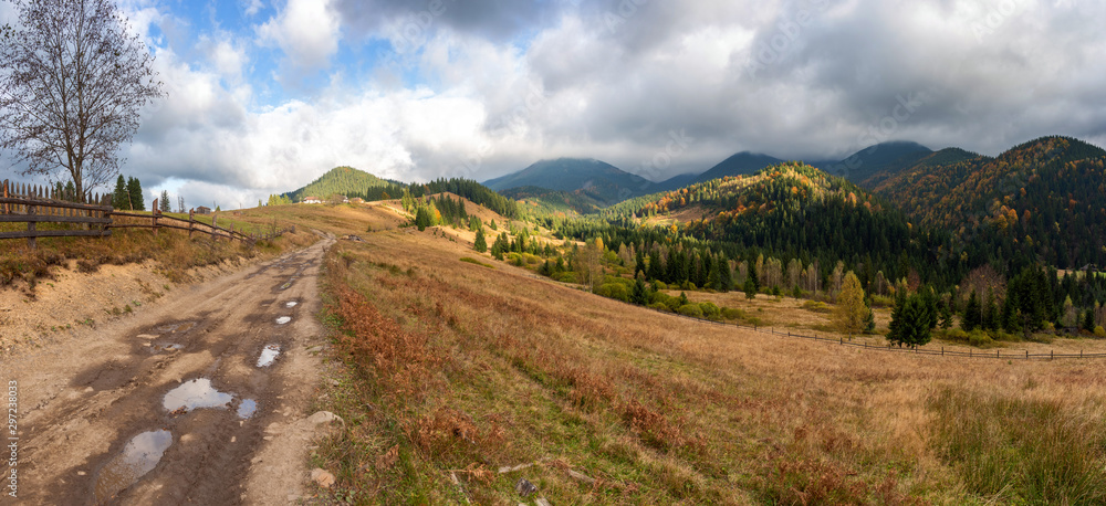 Amazing mountain landscape with colorful vivid sunset on the blue sky