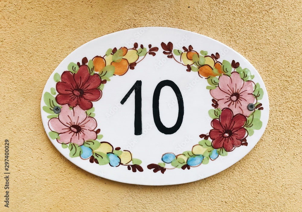 Number 10 in ceramic flowers frame.