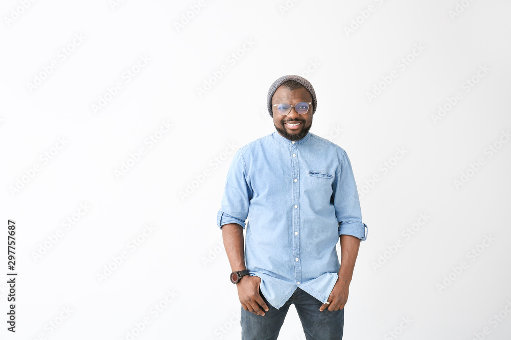 Portrait of happy African-American man on white background