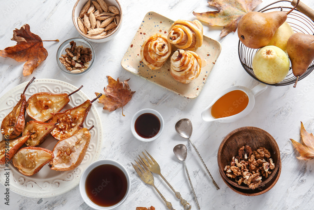 Autumn composition with cooked pears on white background