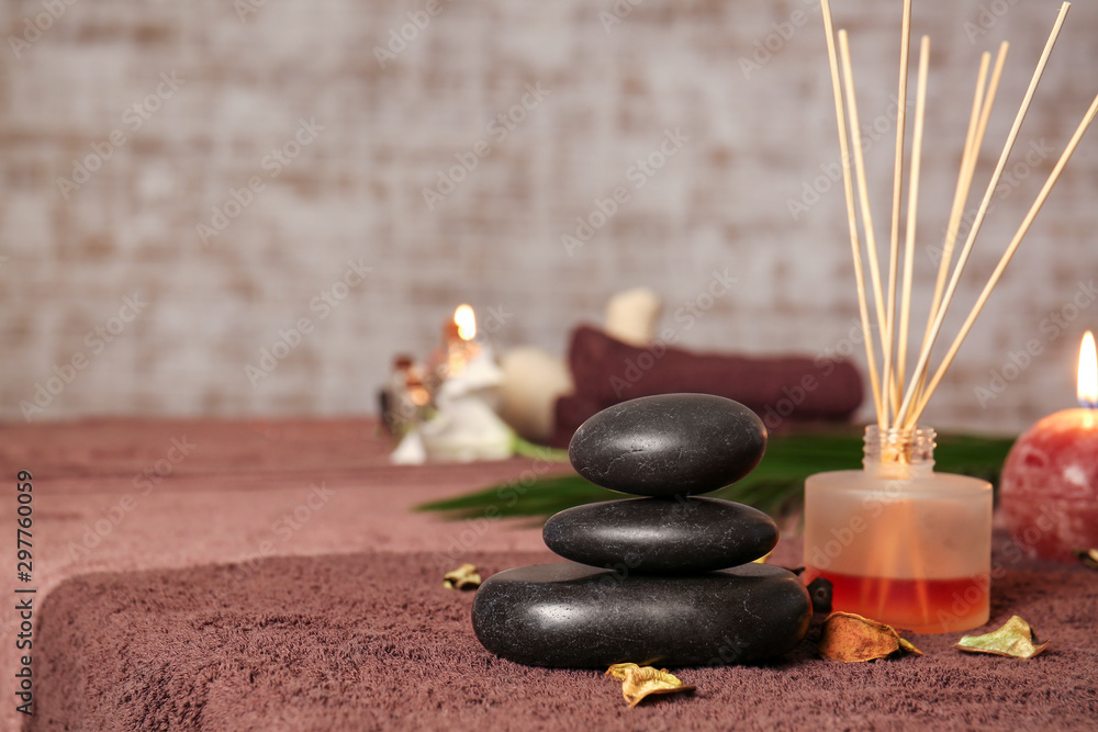 Spa stones with aroma diffuser in beauty salon