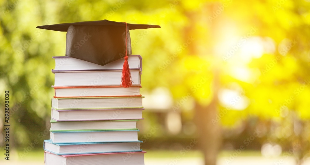 Graduation hat and stack of books