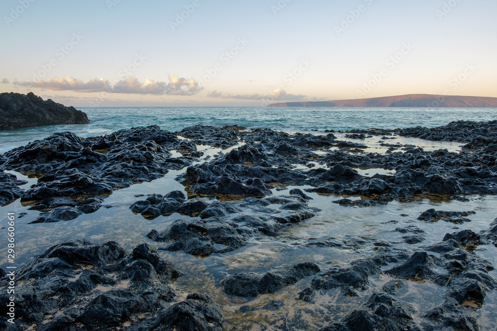 Calm waters of the rocky seascape of the Maui coast