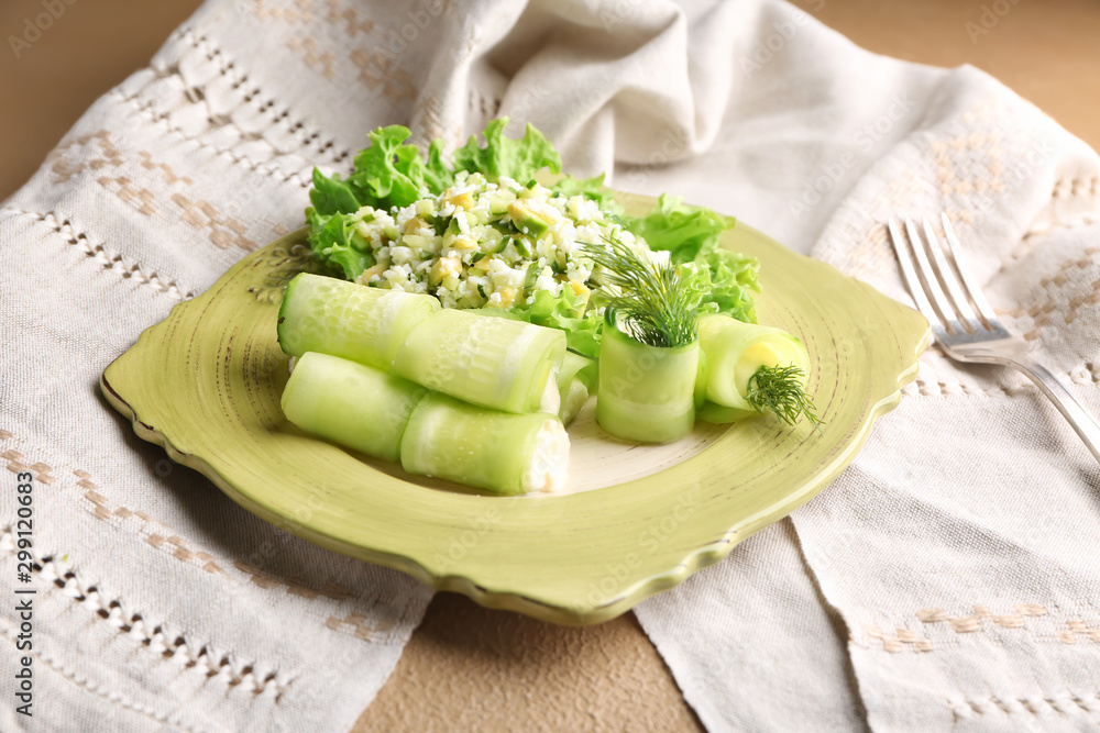 Plate with fresh vegetable salad on color background