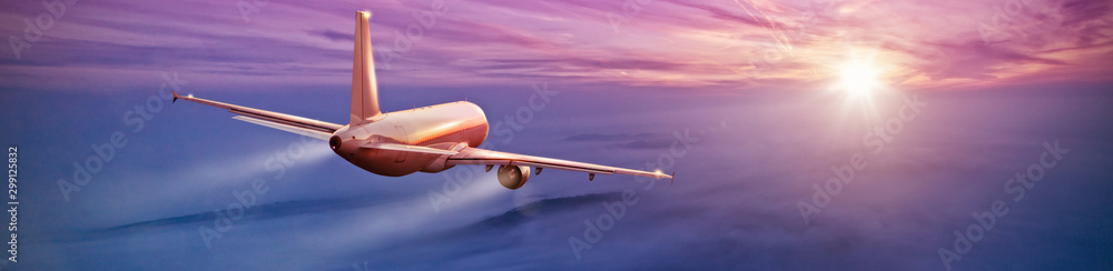 Commercial airplane flying above clouds