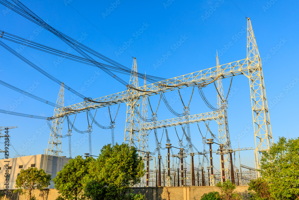 High voltage electricity tower at sunset.substation industrial background.