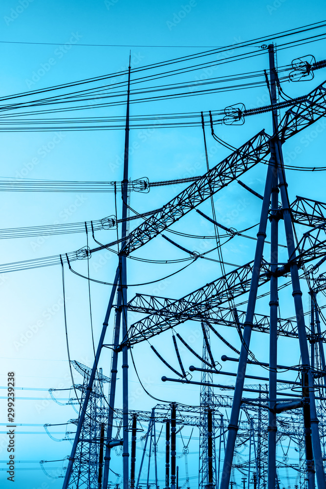 High voltage electricity tower at sunset.substation industrial background.