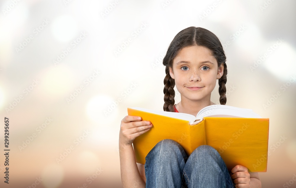 pretty girl The little girl is happy with the book.