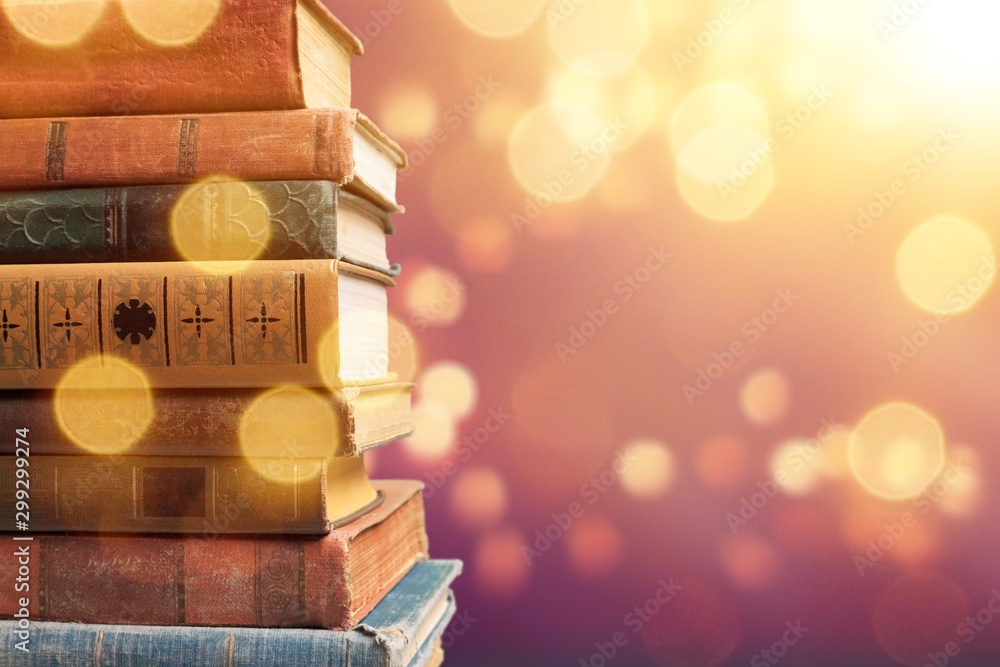 Old Books stacked on background.