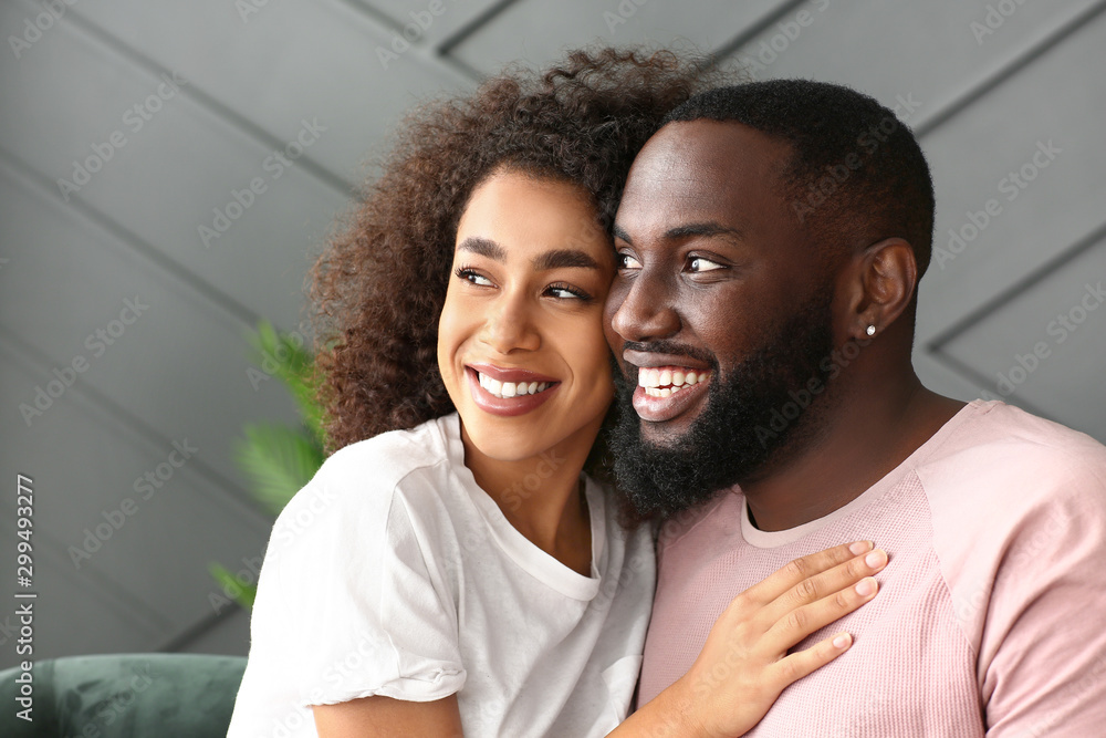 Portrait of happy African-American couple at home