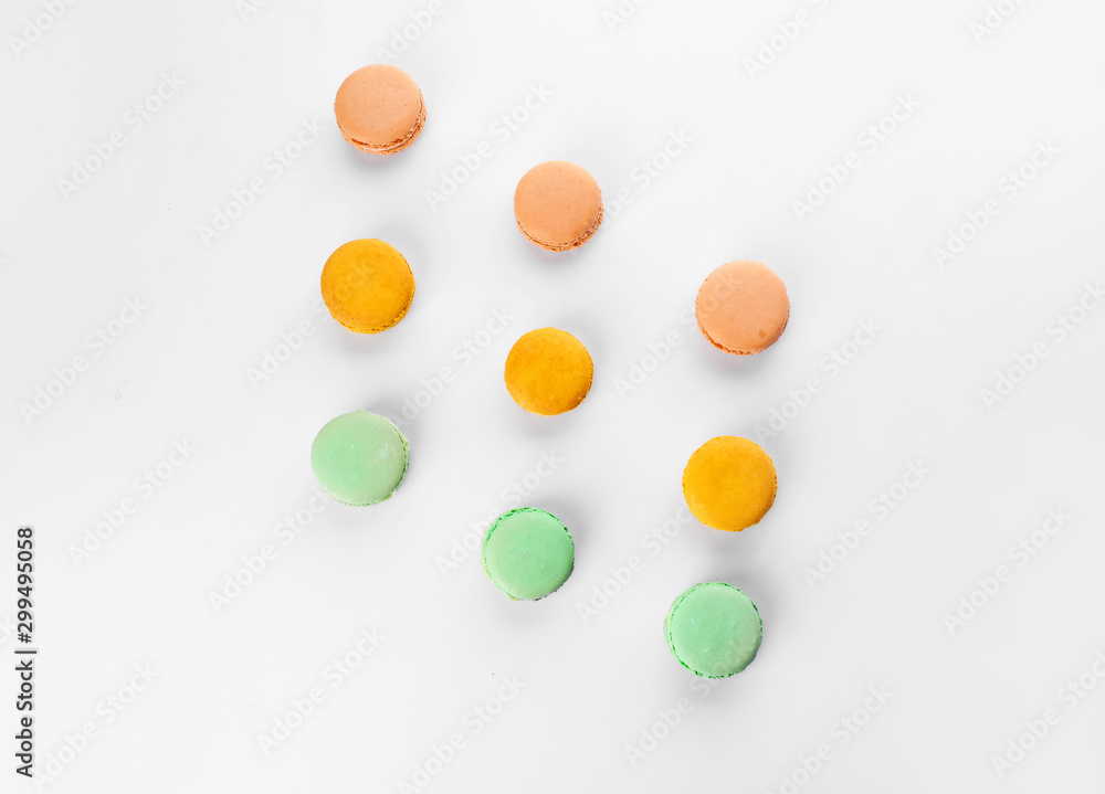 Tasty macarons on white background