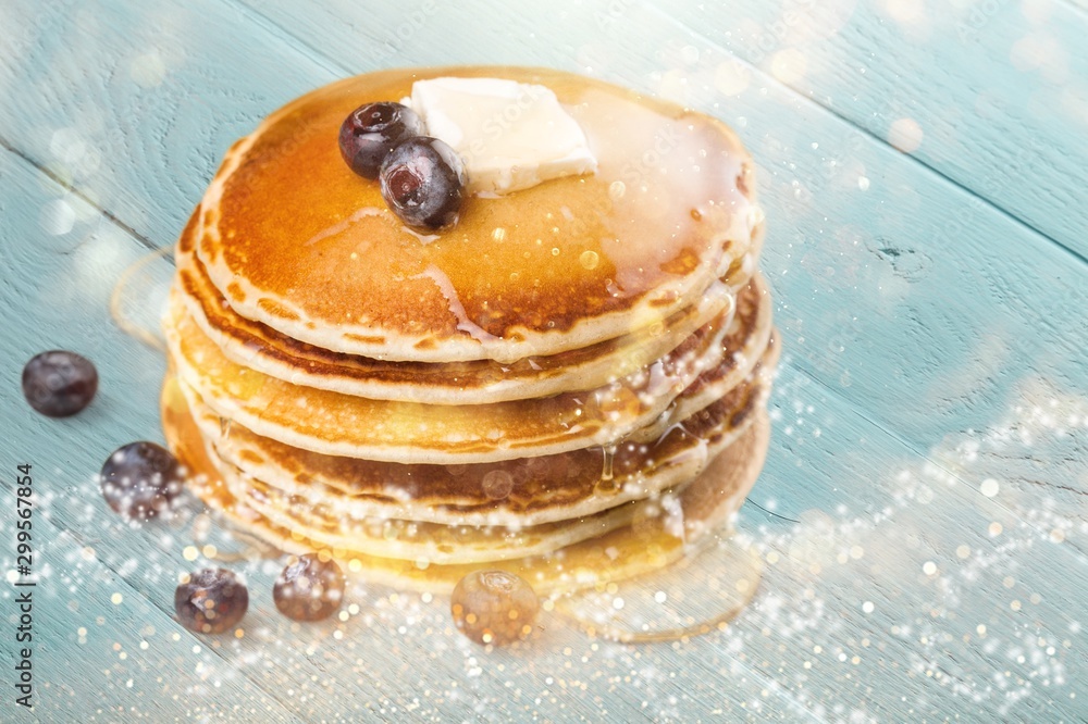 Stack of delicious pancakes with fresh berries