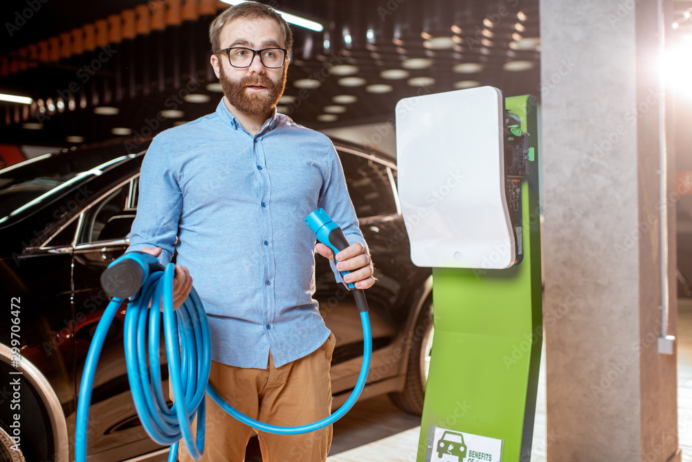 Man choosing car charger at the car dealership