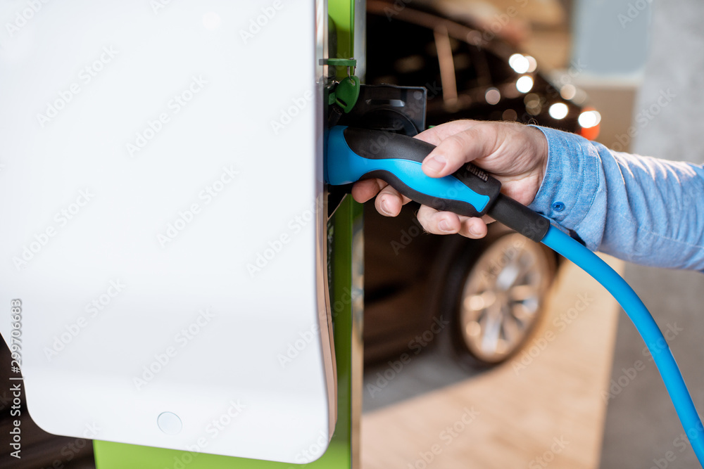 Plugging cable into the charging station