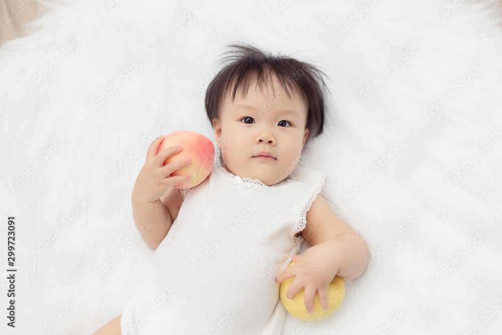 Happy baby child play fun in bed