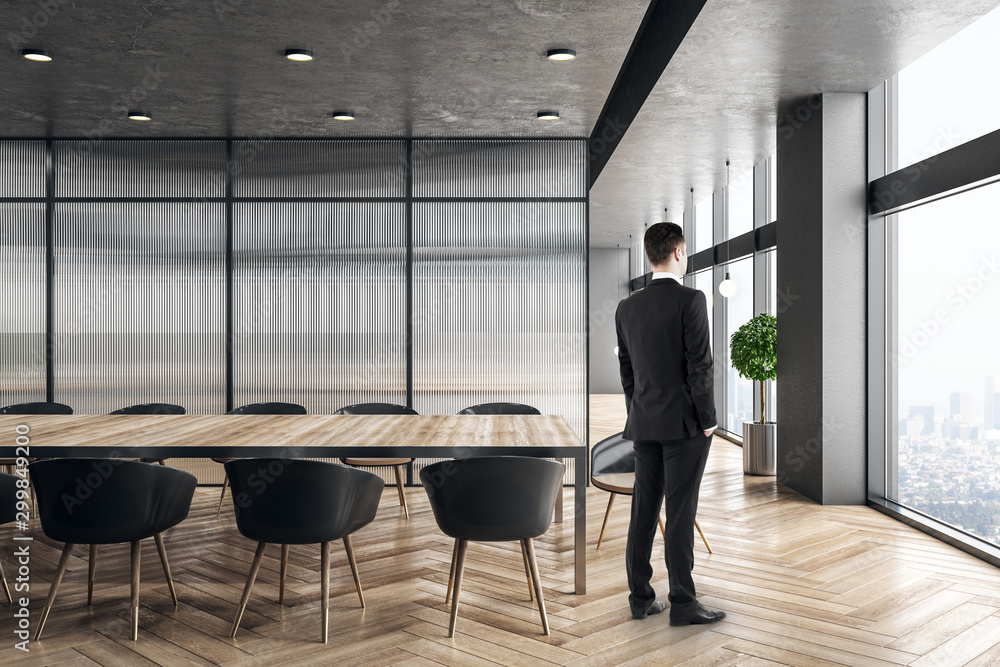 Businessman standing in conference room