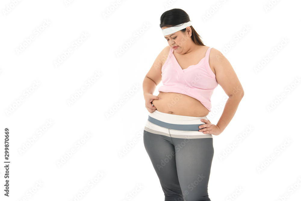 Overweight Asian woman pinching belly fat isolated on white background..