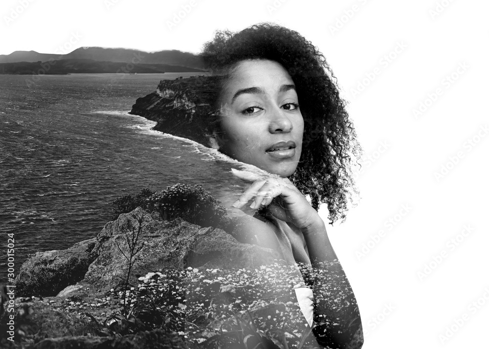 Double exposure of young African-American woman and sea cost