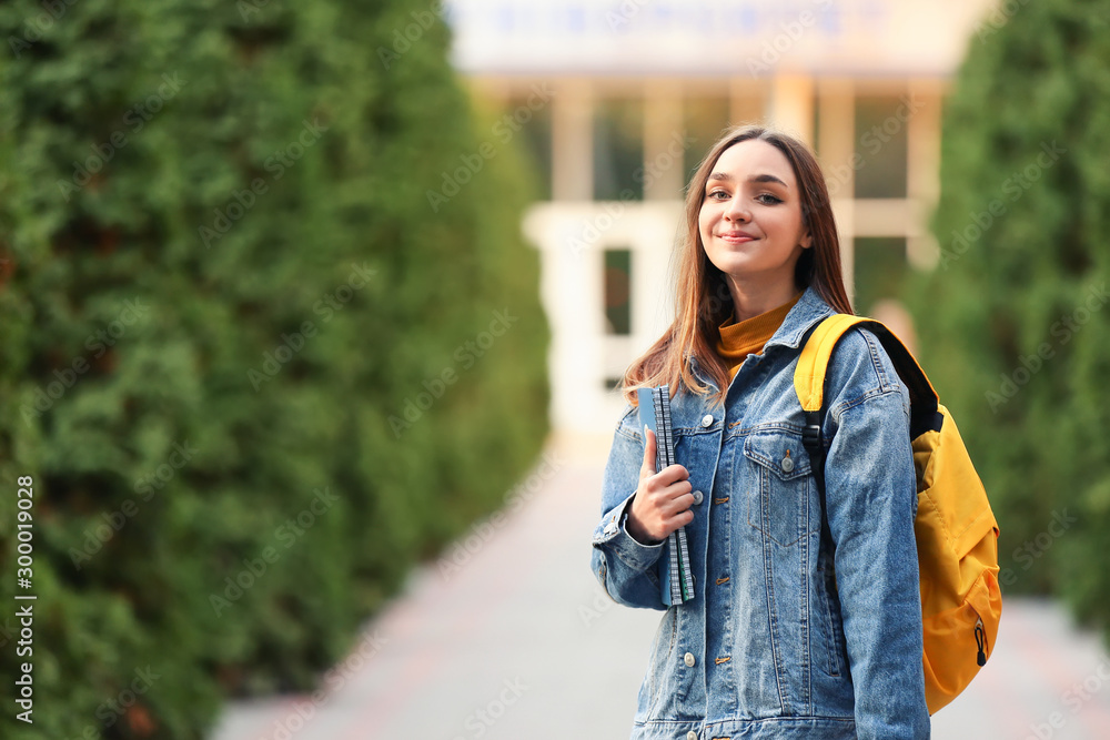 Portrait of teenage female student outdoors