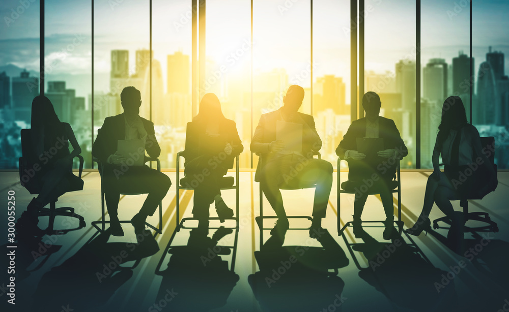 Double exposure image of many business people conference group meeting on city office building in ba