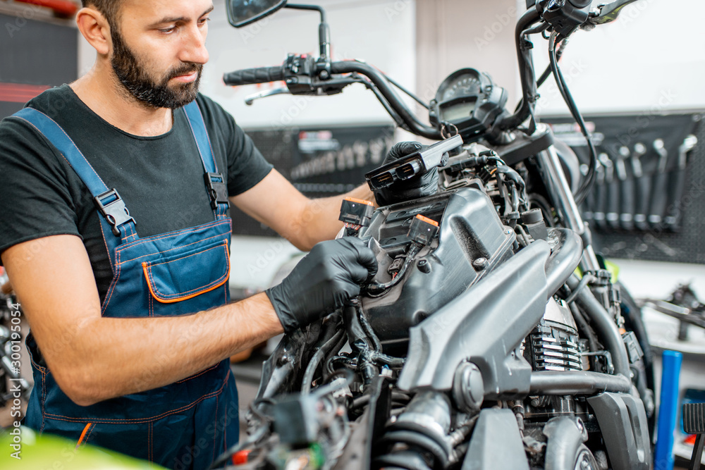 Electrician repairing motorcycle wiring