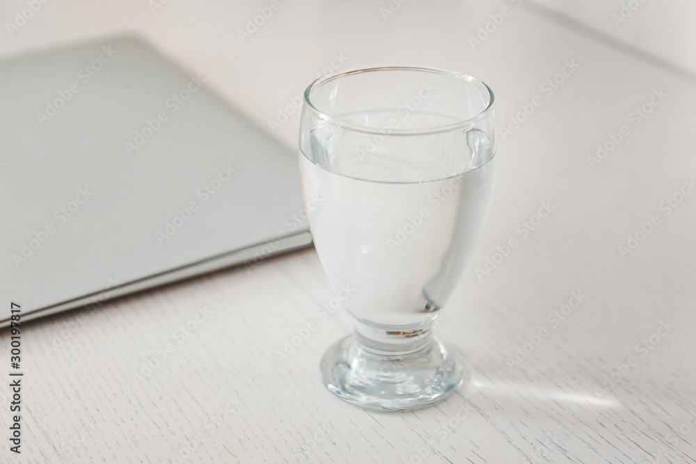 Glass of fresh water on table