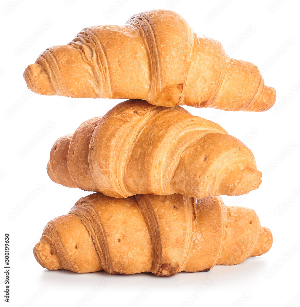 Sweet tasty croissants on white background