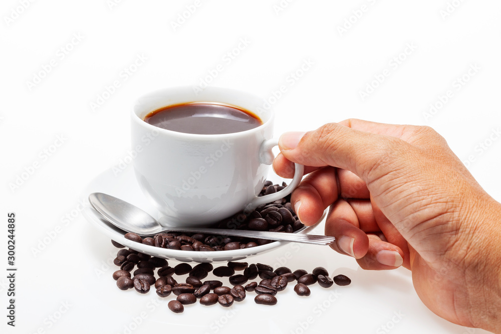 Male hand holding white coffee cup and coffee beans on white background