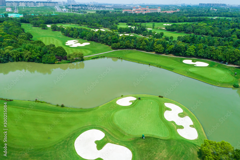 Aerial view of golf course and water