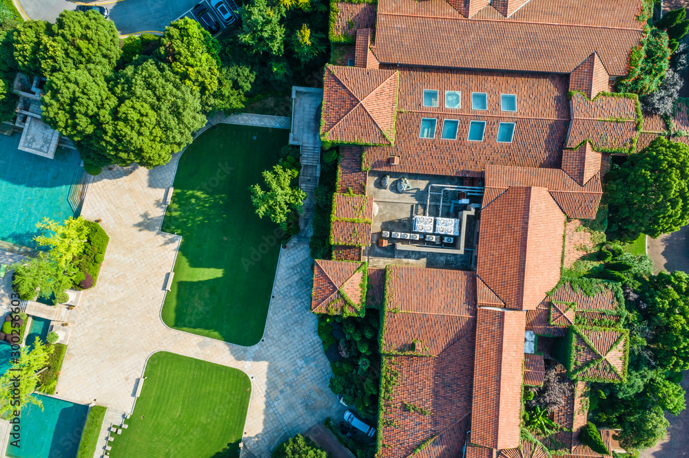 Aerial view of a beautiful green golf course with residential architecture.