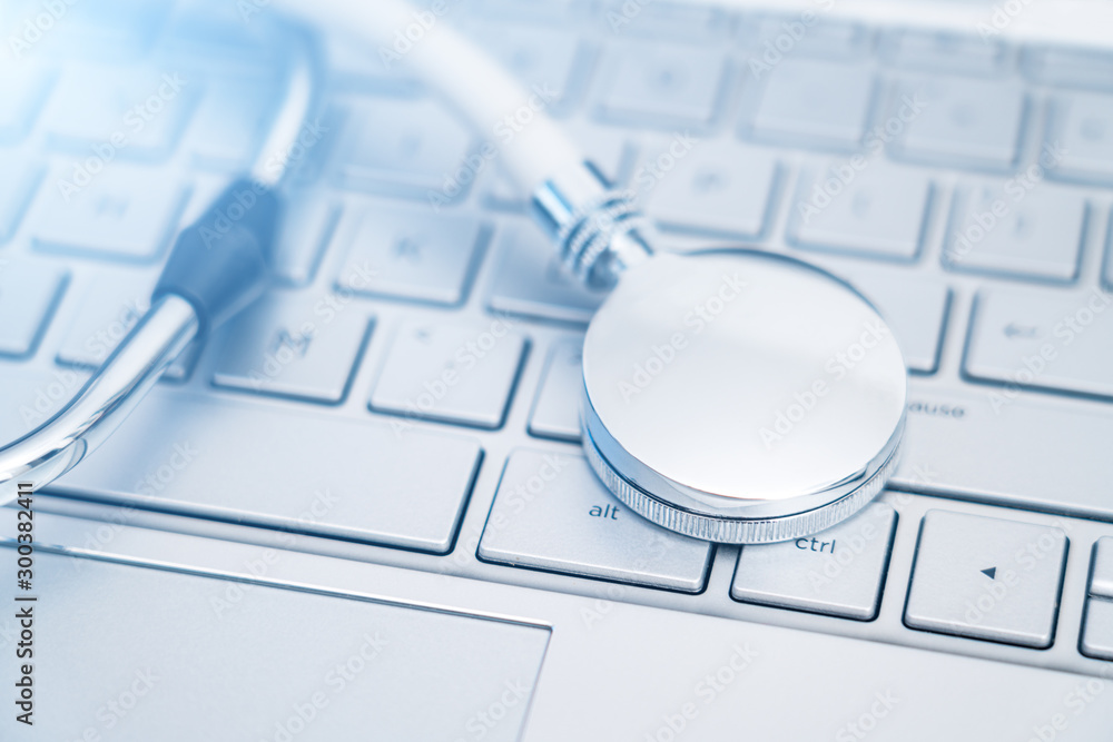 Stethoscope on a silver computer keyboard - health care concept picture