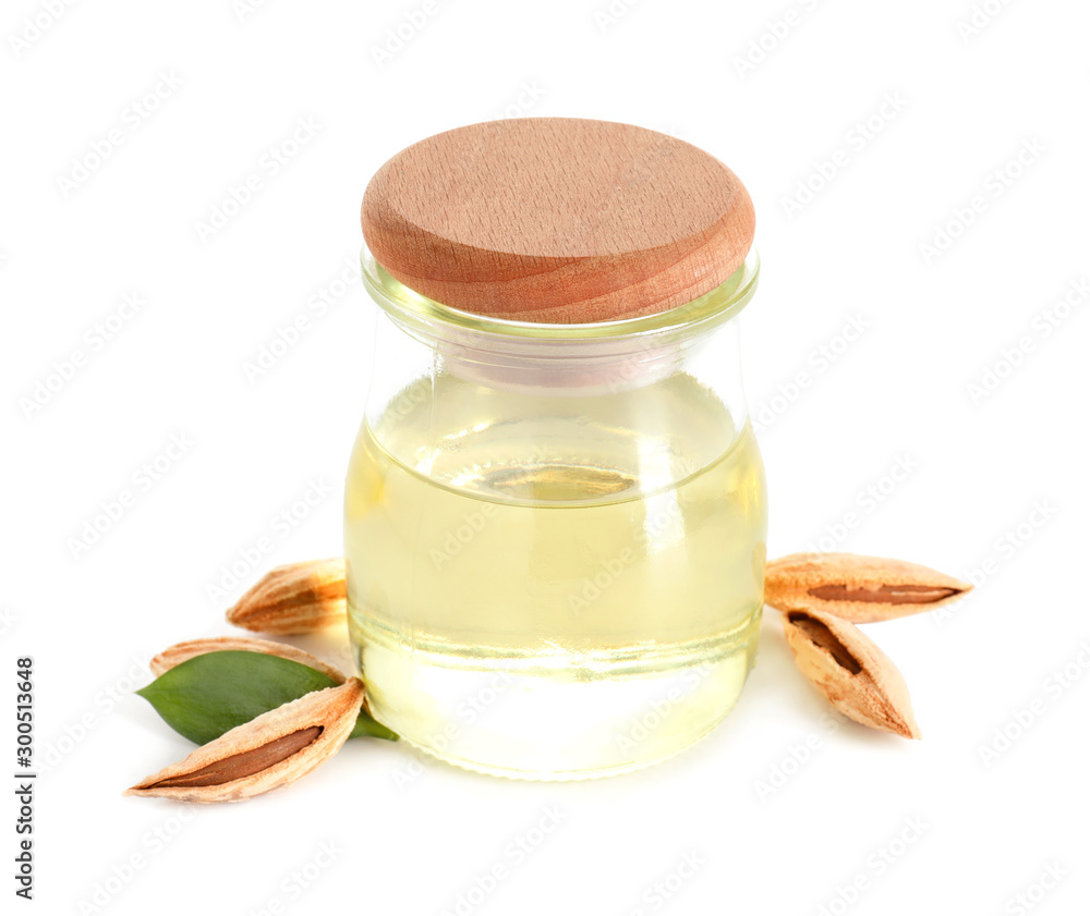 Jar of almond oil on white background