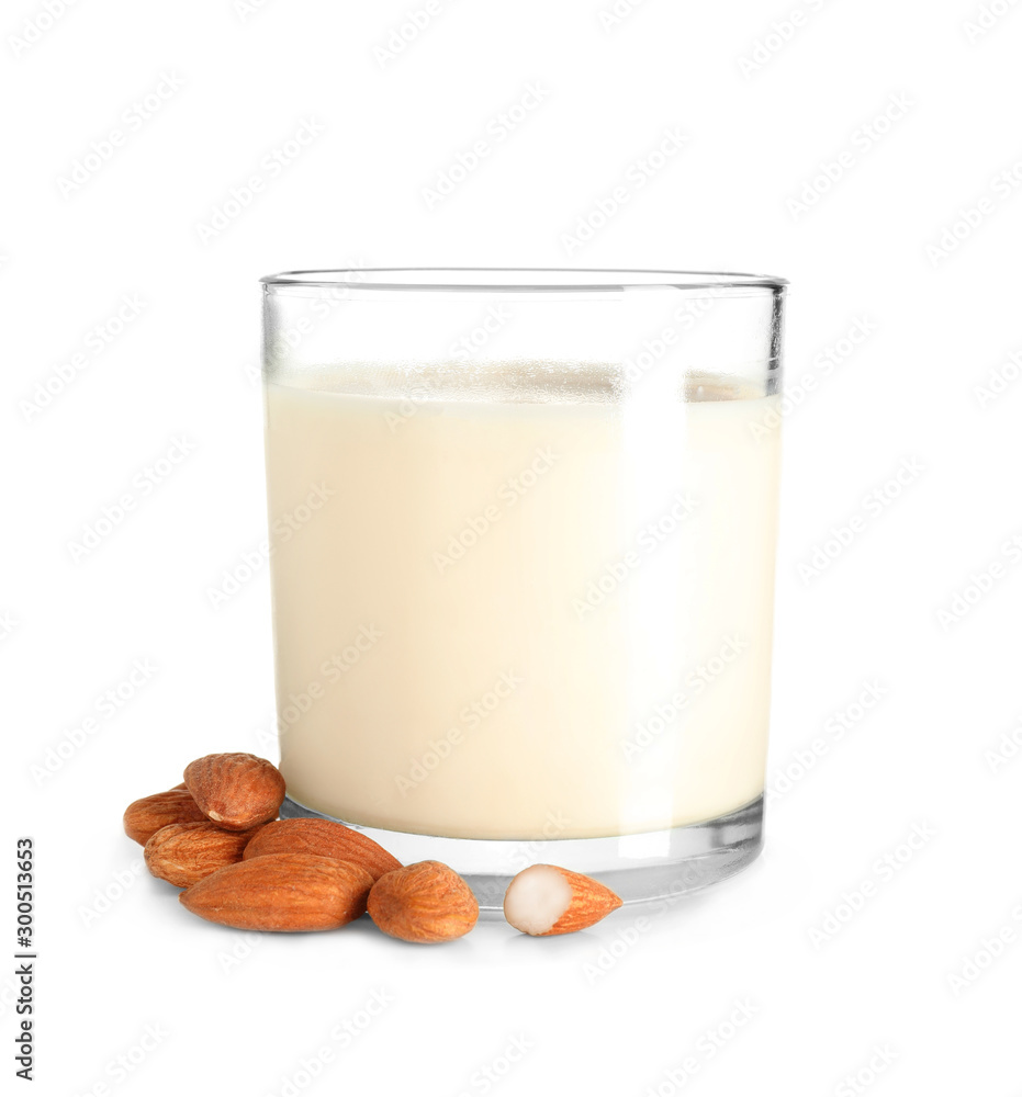 Glass of fresh almond milk on white background