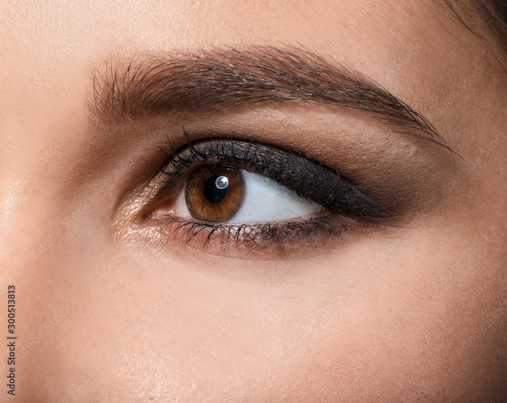 Young woman with beautiful eyebrows, closeup