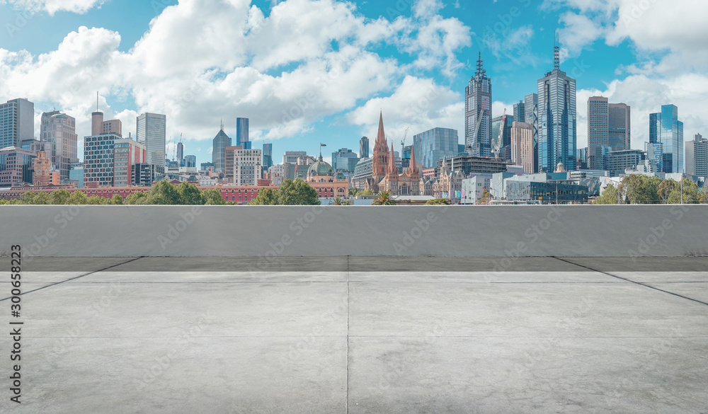 Empty open space top floor with modern skyscraper background