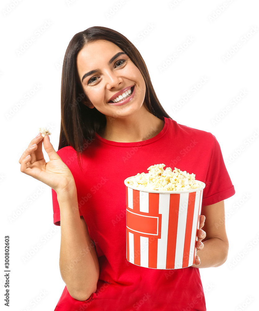 Young woman with popcorn on white background