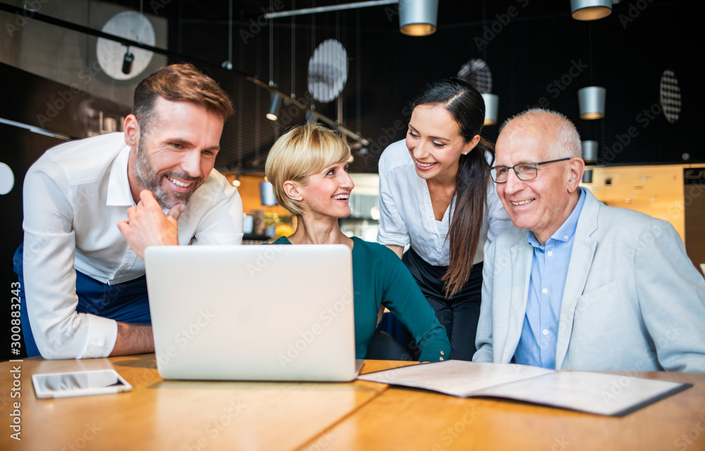 Business people talking about project in a cafe